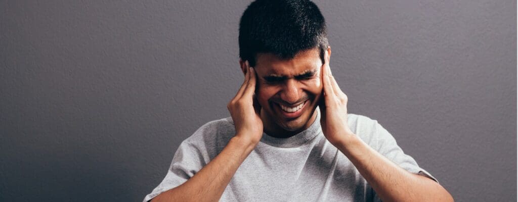 attachment-sore-ear-ear-ache-concept-the-sad-crying-man-with-headache-or-pain-picture-id1073141900