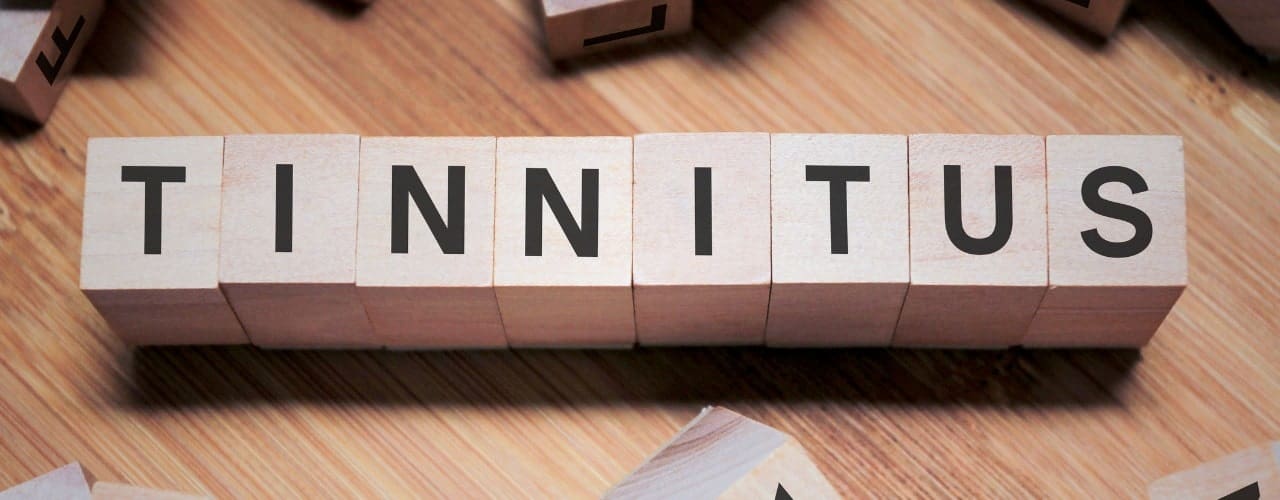 attachment-tinnitus-word-in-wooden-cube-picture-id1157263468-min