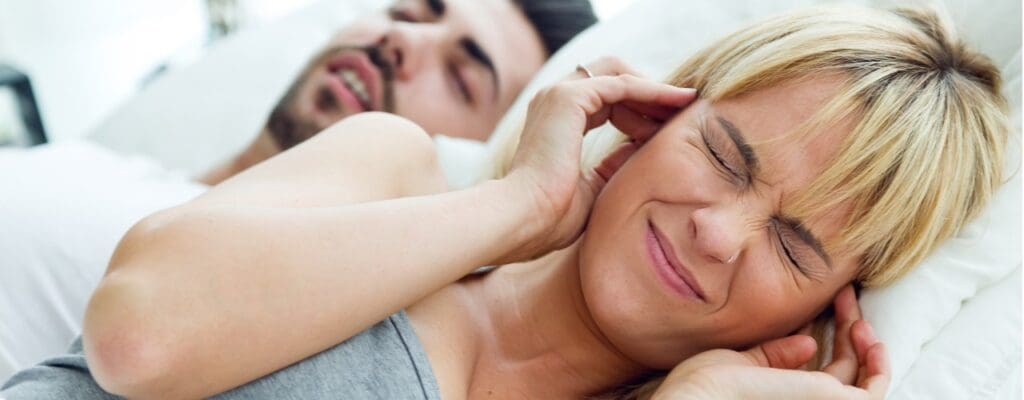 attachment-young-woman-who-can-not-sleep-because-her-husband-snores-picture-id486425182