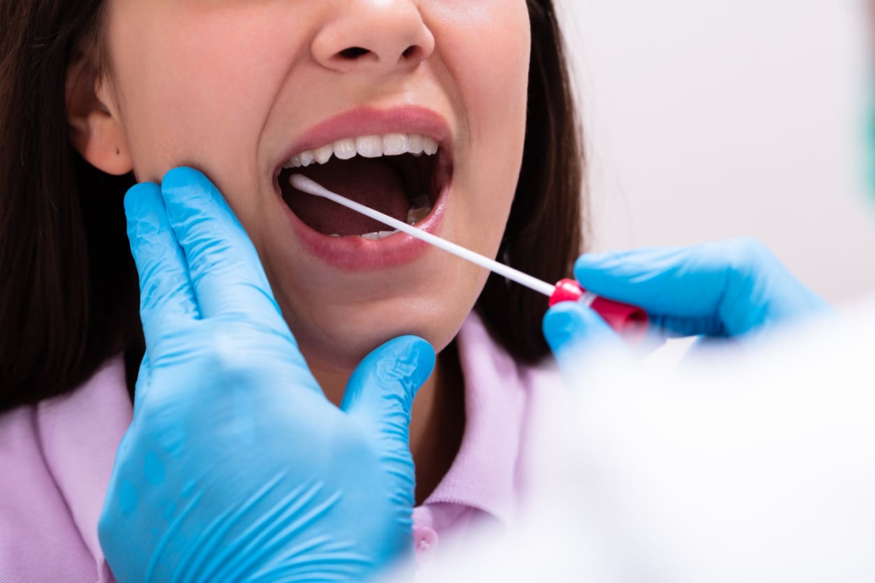 close-up-of-a-doctor-taking-saliva-sample-for-dna-test