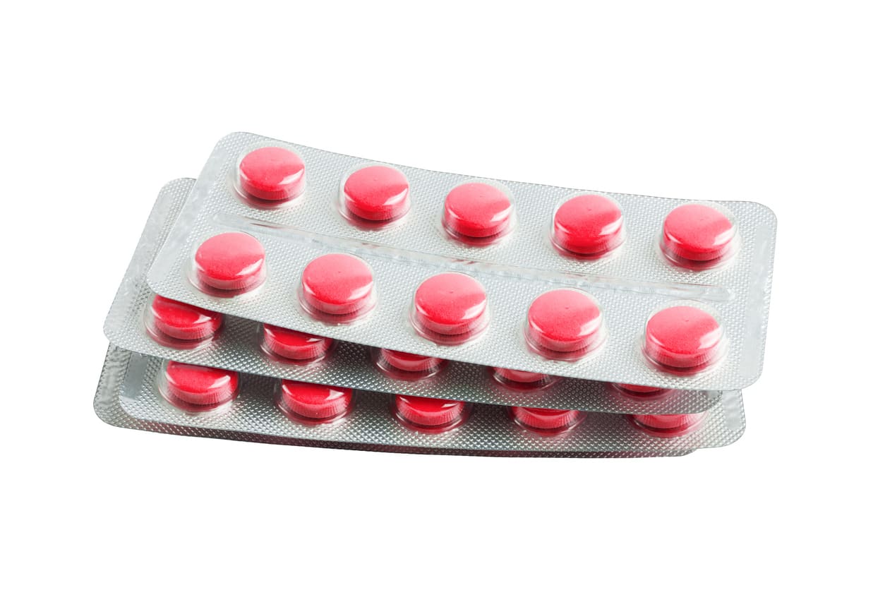 red-medicine-pills-in-a-blister-pack-isolated-on-white-background-healthcare-and-medicine-concept